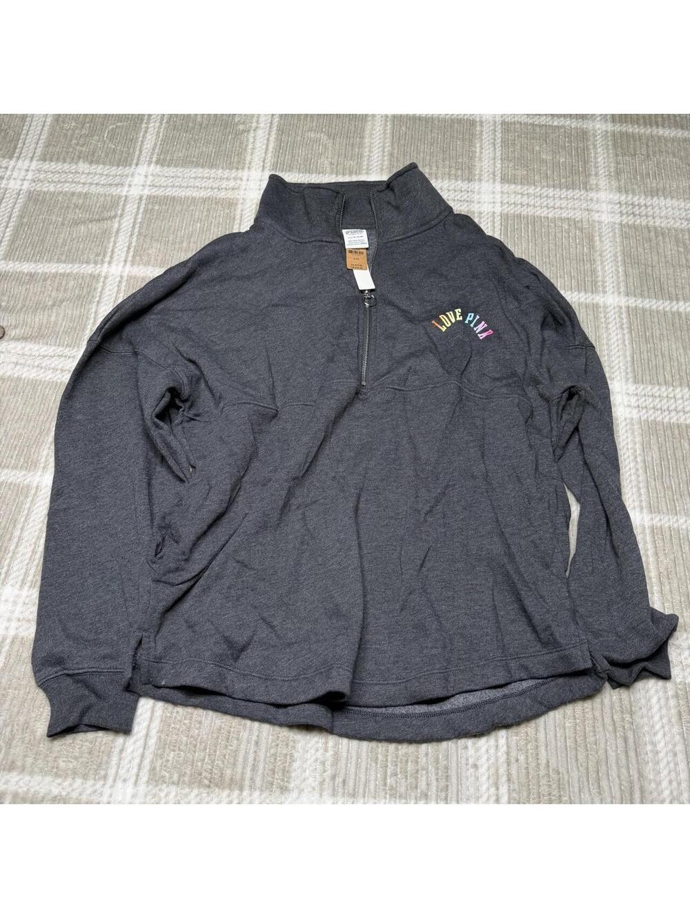 Victoria's Secret PINK quarter zip sweatshirt with multicolored 'PINK' letters